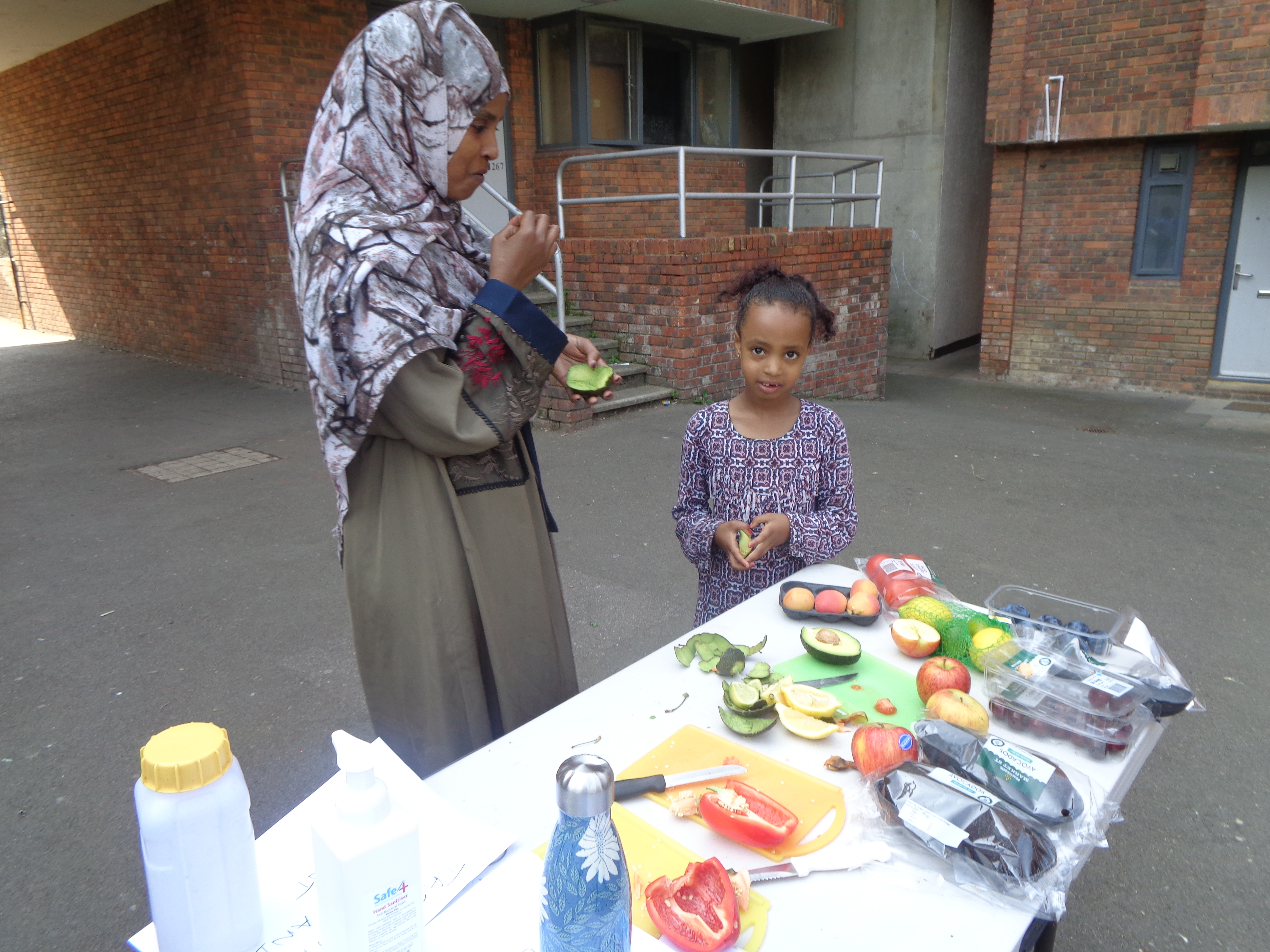 Helping to cut the fruit and vegetables 